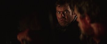 Movie still from “Southbound” (2015), directed by Tyler Gillett – A person with blood on his face; Close Up shot, Over the shoulder angle