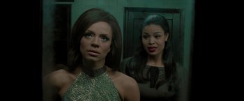 Movie still from “Sparkle” (2012), directed by Salim Akil – Two women standing next to each other in front of a door; Medium shot, Low angle