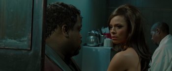 Movie still from “Sparkle” (2012), directed by Salim Akil – A man and a woman in a kitchen looking at one another; Close Up shot, Over the shoulder angle