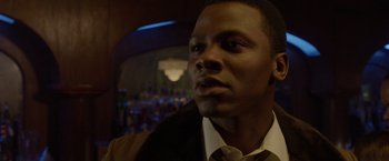 Movie still from “Sparkle” (2012), directed by Salim Akil – A person wearing a suit and tie; Close Up shot, Over the shoulder angle