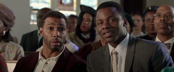 Movie still from “Sparkle” (2012), directed by Salim Akil – A group of men standing next to each other in a room; Close Up shot, High angle