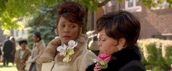 Movie still from “Sparkle” (2012), directed by Salim Akil – Two women in formal wear standing next to each other; Close Up shot, Over the shoulder angle