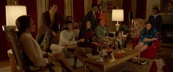 Movie still from “Sparkle” (2012), directed by Salim Akil – A group of people sitting on a couch in a living room; Wide shot, High angle