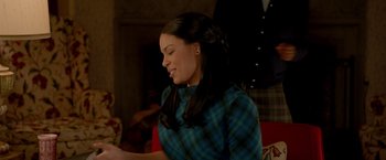 Movie still from “Sparkle” (2012), directed by Salim Akil – A woman in a plaid shirt is looking down; Medium shot, Over the shoulder angle