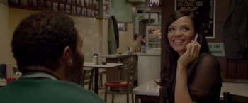 Movie still from “Sparkle” (2012), directed by Salim Akil – Two people sitting at a table in a restaurant; Close Up shot, Over the shoulder angle