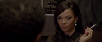 Movie still from “Sparkle” (2012), directed by Salim Akil – A person wearing a black shirt; Close Up shot, Over the shoulder angle