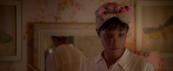 Movie still from “Sparkle” (2012), directed by Salim Akil – A person wearing a headscarf; Close Up shot, Over the shoulder angle