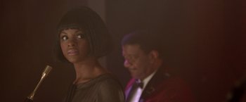 Movie still from “Sparkle” (2012), directed by Salim Akil – A man and a woman are standing in a room together; Close Up shot, Over the shoulder angle
