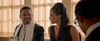 Movie still from “Sparkle” (2012), directed by Salim Akil – A man and a woman sitting at a table talking to each other; Close Up shot, Over the shoulder angle