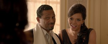 Movie still from “Sparkle” (2012), directed by Salim Akil – A man and a woman posing for a picture; Close Up shot, High angle