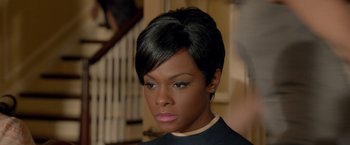 Movie still from “Sparkle” (2012), directed by Salim Akil – A person with short black hair; Close Up shot, High angle