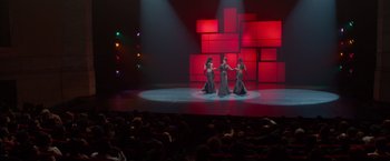 Movie still from “Sparkle” (2012), directed by Salim Akil – A group of women performing on a stage in front of an audience; Extreme Wide shot, High angle