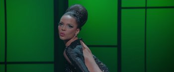Movie still from “Sparkle” (2012), directed by Salim Akil – A woman in a black and silver dress; Medium shot, Low angle