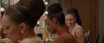 Movie still from “Sparkle” (2012), directed by Salim Akil – A woman with a bun in front of two other women; Close Up shot, Over the shoulder angle