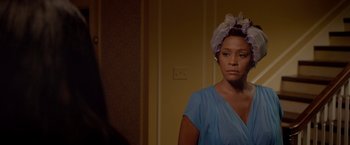 Movie still from “Sparkle” (2012), directed by Salim Akil – A woman in a blue dress with a white head scarf; Close Up shot, Over the shoulder angle