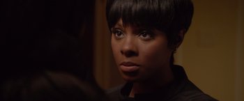 Movie still from “Sparkle” (2012), directed by Salim Akil – A person wearing a black shirt; Close Up shot, Over the shoulder angle