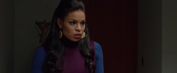 Movie still from “Sparkle” (2012), directed by Salim Akil – A woman with long black hair wearing a purple and blue shirt; Close Up shot, Over the shoulder angle