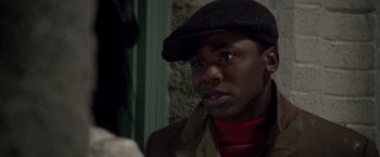 Movie still from “Sparkle” (2012), directed by Salim Akil – A person wearing a hat; Close Up shot, Over the shoulder angle