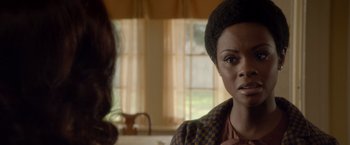 Movie still from “Sparkle” (2012), directed by Salim Akil – A woman in a checkered jacket looking at a man in a checkered jacket; Close Up shot, Over the shoulder angle