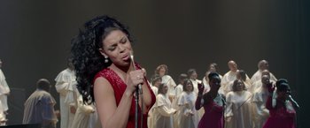 Movie still from “Sparkle” (2012), directed by Salim Akil – A group of women singing in front of a microphone; Medium shot, High angle