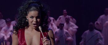 Movie still from “Sparkle” (2012), directed by Salim Akil – A woman holding a toothbrush in front of a group of people; Close Up shot, High angle