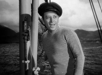 Movie still from “Spawn of the North” (1938), directed by Henry Hathaway – A black and white photo of a man wearing a hat; Medium shot, Low angle