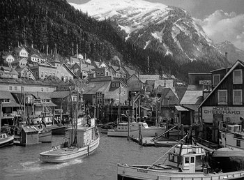 Movie still from “Spawn of the North” (1938), directed by Henry Hathaway – A black - and - white photo of boats in a harbor; Extreme Wide shot, High angle