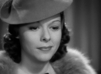 Movie still from “Spawn of the North” (1938), directed by Henry Hathaway – An old photo of a woman wearing a hat and a fur coat; Close Up shot, Low angle