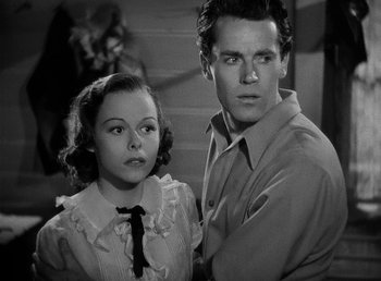 Movie still from “Spawn of the North” (1938), directed by Henry Hathaway – A man and a woman standing next to each other; Medium shot, High angle