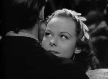 Movie still from “Spawn of the North” (1938), directed by Henry Hathaway – A man and a woman embracing each other in a black and white photo; Close Up shot, Low angle