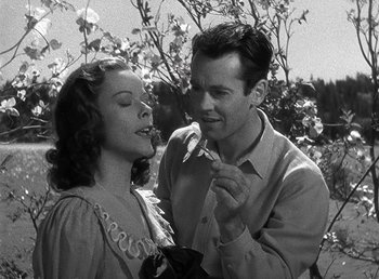 Movie still from “Spawn of the North” (1938), directed by Henry Hathaway – A man and a woman are eating a banana; Close Up shot, Low angle