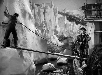 Movie still from “Spawn of the North” (1938), directed by Henry Hathaway – A man on a boat in the middle of the ocean; Wide shot, High angle
