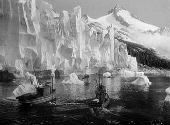 Movie still from “Spawn of the North” (1938), directed by Henry Hathaway – A black - and - white photo of boats in the water; Extreme Wide shot, High angle