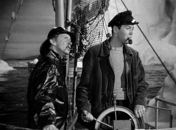 Movie still from “Spawn of the North” (1938), directed by Henry Hathaway – Two men on a sailboat in the water; Medium shot, High angle