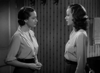 Movie still from “Spawn of the North” (1938), directed by Henry Hathaway – Two women are facing each other in a black and white photo; Medium shot, High angle