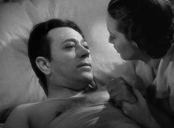 Movie still from “Spawn of the North” (1938), directed by Henry Hathaway – A man and a woman in a bed; Close Up shot, High angle