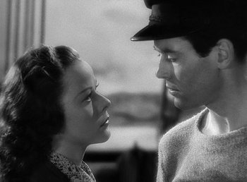 Movie still from “Spawn of the North” (1938), directed by Henry Hathaway – A man and a woman looking at one another; Close Up shot, Low angle