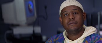 Movie still from “Species” (1995), directed by Roger Donaldson – A person wearing a hat; Close Up shot, Low angle