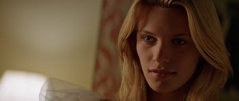 Movie still from “Species” (1995), directed by Roger Donaldson – A person with long hair; Close Up shot, Low angle