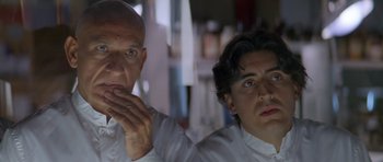 Movie still from “Species” (1995), directed by Roger Donaldson – A man and a woman looking at the camera; Close Up shot, Low angle