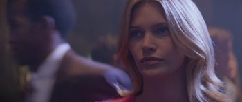 Movie still from “Species” (1995), directed by Roger Donaldson – A person getting a hair cut; Close Up shot, Over the shoulder angle