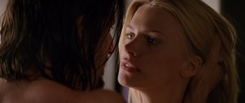 Movie still from “Species” (1995), directed by Roger Donaldson – A woman's face with her hand on her face; Close Up shot, Low angle