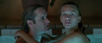 Movie still from “Species” (1995), directed by Roger Donaldson – A man and a woman looking into each other's eyes; Close Up shot, Low angle