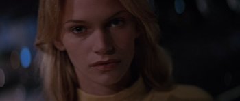 Movie still from “Species” (1995), directed by Roger Donaldson – A woman's face in the dark; Close Up shot, Low angle