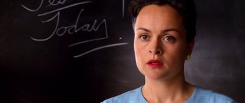 Movie still from “Speed Racer” (2008), directed by Lilly Wachowski – A woman standing in front of a chalkboard; Close Up shot, Over the shoulder angle