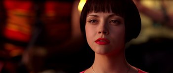 Movie still from “Speed Racer” (2008), directed by Lilly Wachowski – A person wearing a red shirt; Close Up shot, Over the shoulder angle