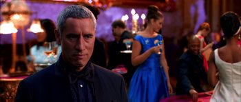 Movie still from “Speed Racer” (2008), directed by Lilly Wachowski – A man and a woman are standing in a room; Close Up shot, Over the shoulder angle