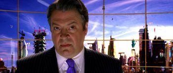 Movie still from “Speed Racer” (2008), directed by Lilly Wachowski – A person wearing a suit and a tie; Close Up shot, Low angle