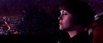 Movie still from “Speed Racer” (2008), directed by Lilly Wachowski – A person wearing a black shirt; Close Up shot, Low angle