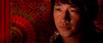 Movie still from “Speed Racer” (2008), directed by Lilly Wachowski – A person wearing a black shirt; Close Up shot, High angle